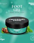 Organic Mimi foot gel jar with mint leaves on a teal background