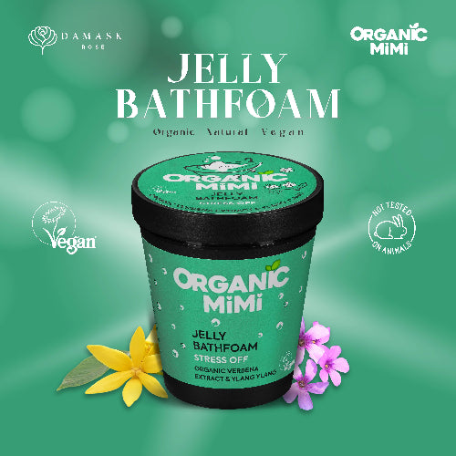 Green jar of Organic Mimi Jelly Bathfoam with flowers on a green background