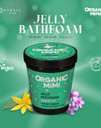 Green jar of Organic Mimi Jelly Bathfoam with flowers on a green background