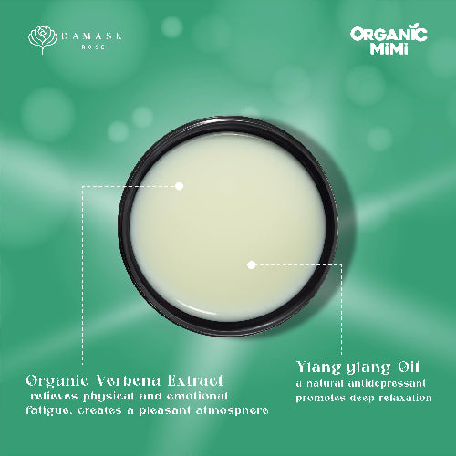 Container of Organic Verbena Extract and Ylang ylang Oil on a green background with branding.