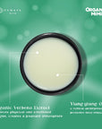 Container of Organic Verbena Extract and Ylang ylang Oil on a green background with branding.