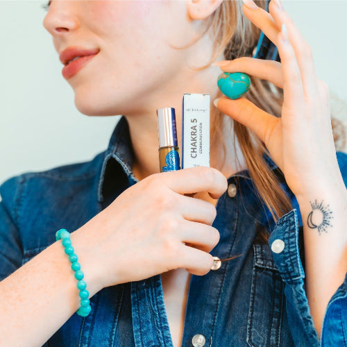 Chakra 5 Communication roll on in hand