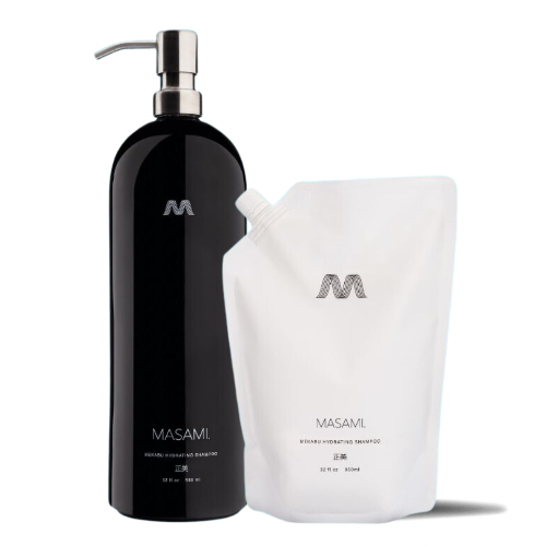 A black ceramic refillable shampoo bottle with a pump dispenser alongside a white refill pouch, both labeled with the brand name 'MASAMI'.