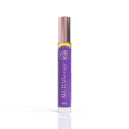 A roll-on perfume oil bottle with a purple label and pink cap, labeled 'ADORAtherapy' and named 'Chakra 6 Clarity'.