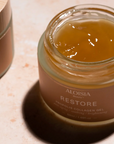 Jar of Aloisia Restore Probiotic Collagen Gel on a light surface