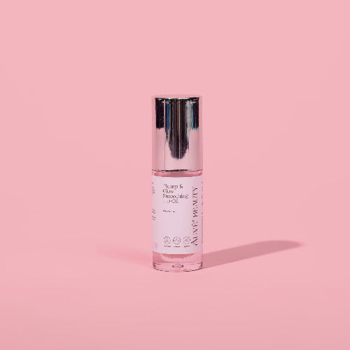 Auve Beauty plump and glow smoothing lip oil on pink background