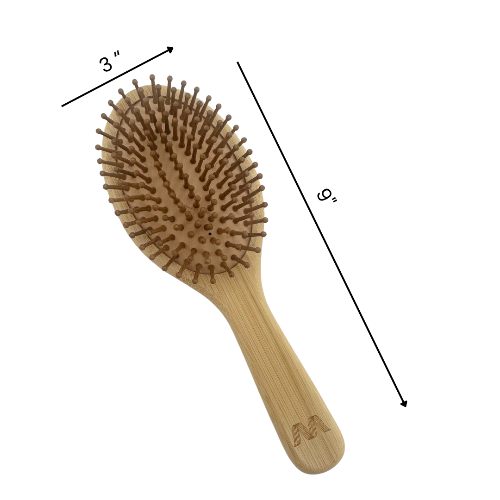 Wooden hairbrush with measurements on a white background