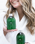 Blonde holding MASAMI shampoo & conditioner