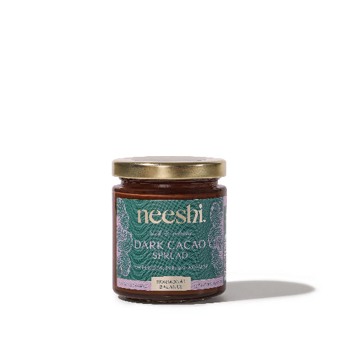 Jar of neeshi dark cacao spread on a white background