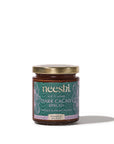 Jar of neeshi dark cacao spread on a white background