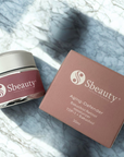 Sbeauty skincare product jar and box on a textured surface