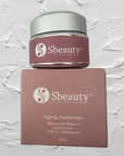 Sbeauty skincare product jar and box on a textured gray background