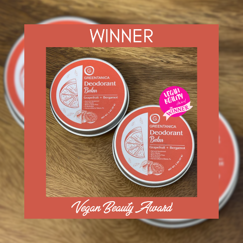 Two tins of Greentanica Deodorant Balm on a wooden surface with 'Winner' and 'Vegan Beauty Award' text overlay.