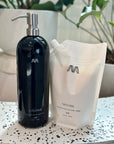 Pro-ocean conditioner and pouch on speckled countertop