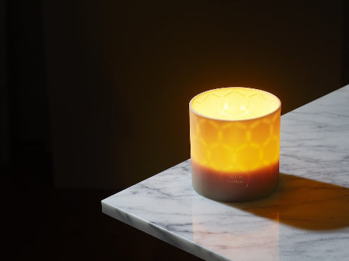 Isle de Nature candle glowing from the inside