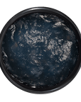 Round black container with a textured surface on a transparent background