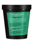 Jelly bath foam container with green label on a teal background