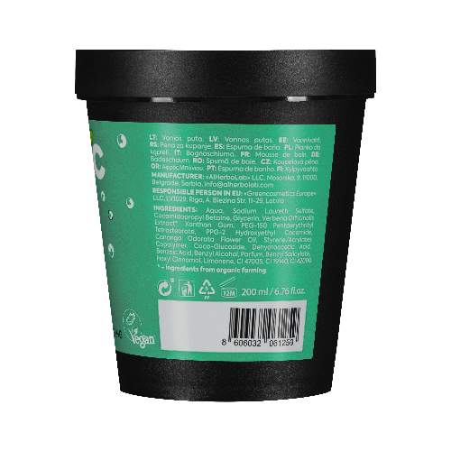 Back view of a green and black container with text and symbols on a teal background
