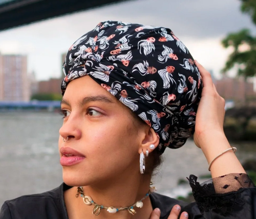 Model wearing black mermaid aqua leisure turban