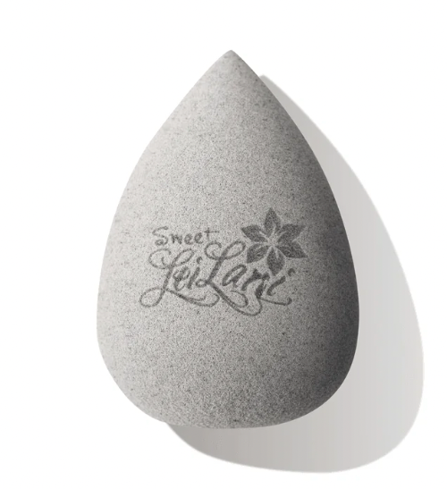 Gray makeup sponge with 'sweet Leilani' branding on a white background