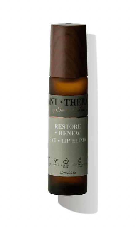 Bottle of 'Restore + Renew' eye and lip elixir with a brown cap on a white background