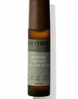 Bottle of 'Restore + Renew' eye and lip elixir with a brown cap on a white background