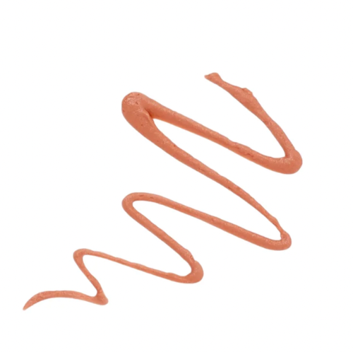 Smeared beige makeup product on a white background