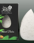 White stone with 'Island Babes' branding next to a black box with palm tree design.