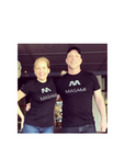 A man and a woman standing and posing in front of a camera, both wearing black T-shirts with the 'MASAMI' brand logo on the front.