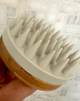 White Scalp Scrubber in shower