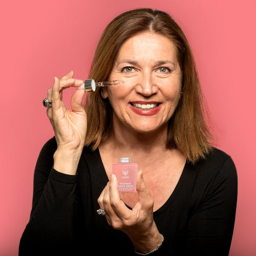 Caire Beauty model with serum