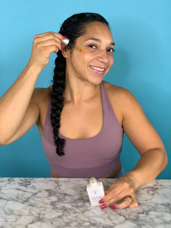 Model using Olecea Vitamin C Glow