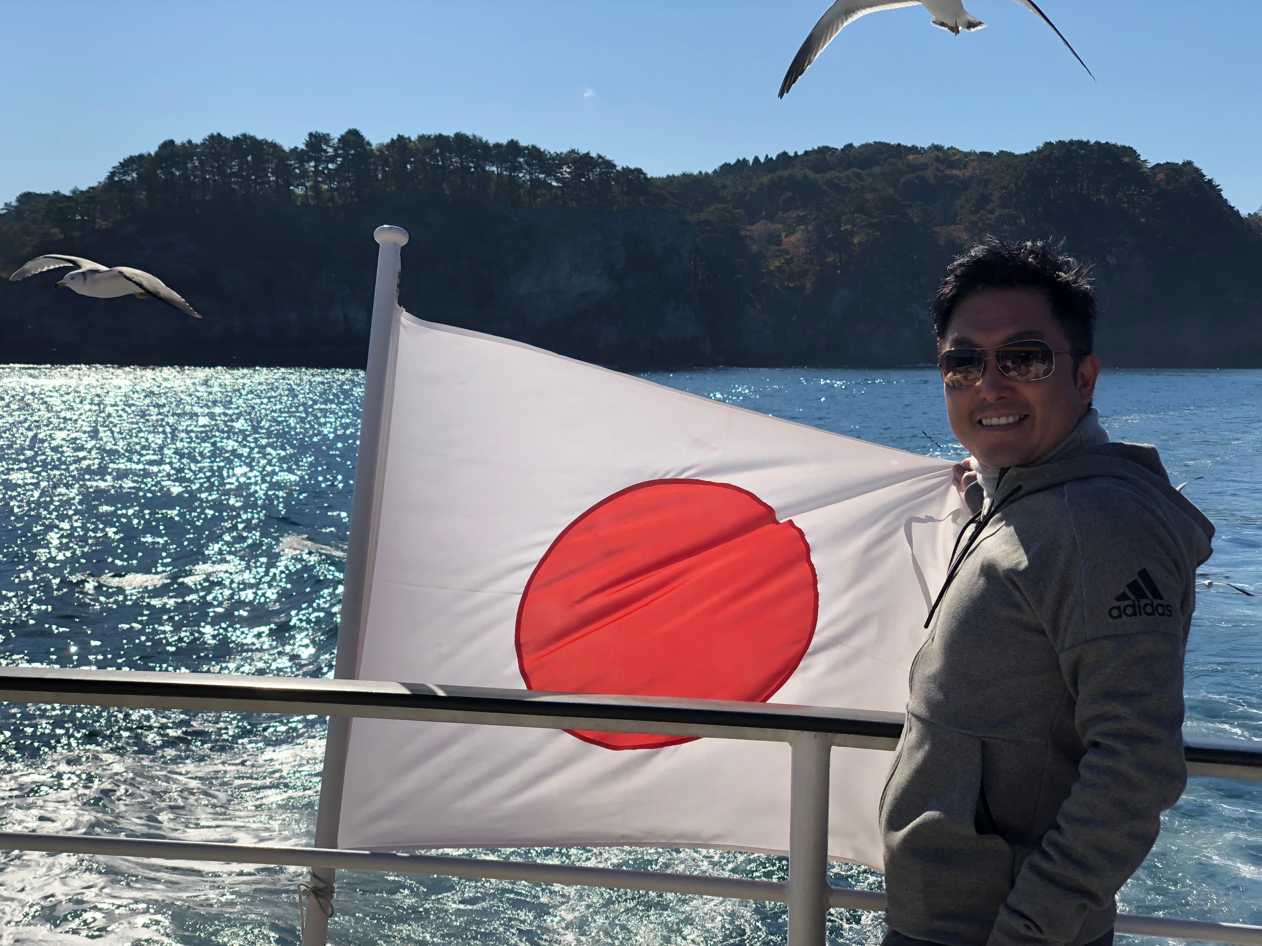 Masahiro on a boat in Japan bay
