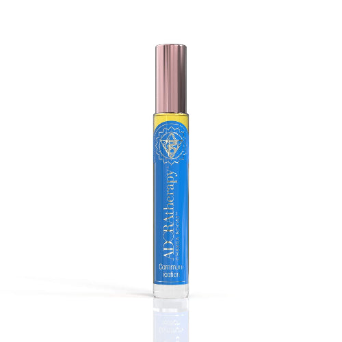 A roll-on perfume oil bottle with a blue label featuring the brand name and product title, with a cap on top.