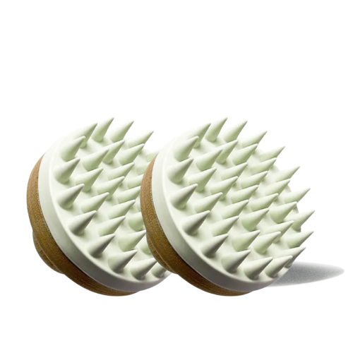 Two scalp massagers with spike-like texture on a white background