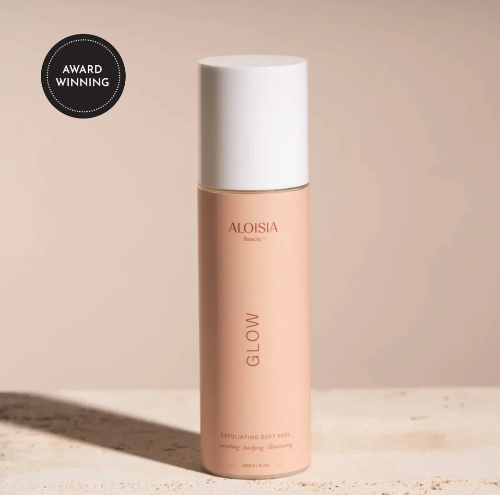 Aloesia Glow product bottle on a beige background with an award badge.