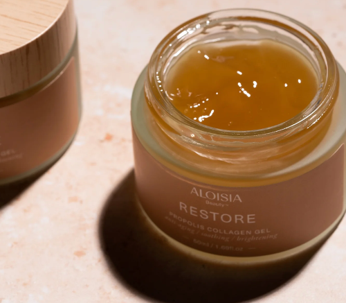 Jar of Aloisia Restore Probiotic Collagen Gel on a light surface