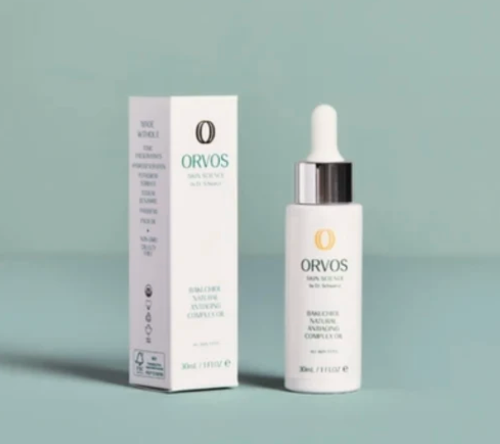 ORVOS bottle and box on green background