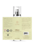 A 4 fl oz (120ml) bottle of IDRA Ukiyo essential oil fragrance, showing the clear spray top and the beige back label with product details.