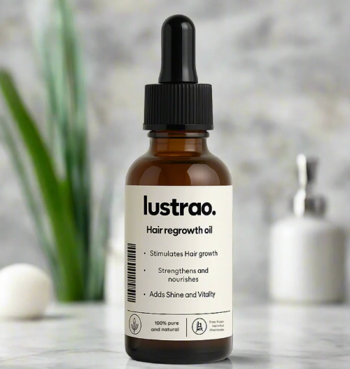 A bottle of lustrao. Hair regrowth oil with a black dropper cap and white label, set against a softly blurred bathroom background with a plant and soap dispenser.