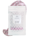 A MASAMI fast drying hair towel in a clear stand-up pouch with a white label, with the pink and white patterned hair towel visible behind and around the package on a white background.