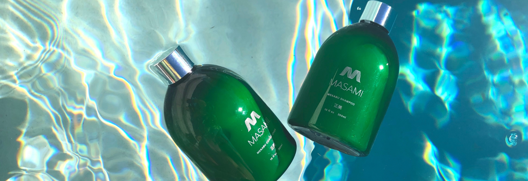 two masami bottles floating underwater